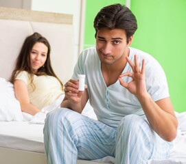 Man using pills for woman satisfaction