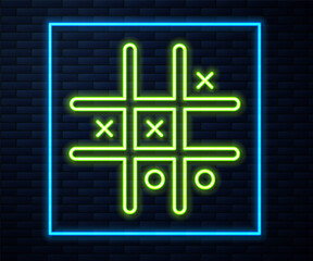 Glowing neon line Tic tac toe game icon isolated on brick wall background. Vector.