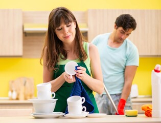 Young couple working at kitchen