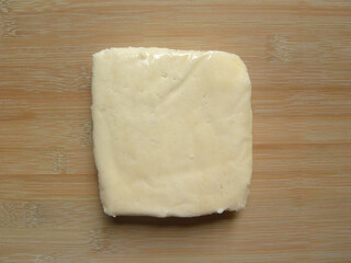 Yellow color raw fresh Paneer cheese