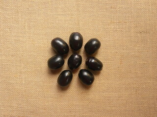 Black color raw whole fresh Java plum fruits or Syzygium cumini