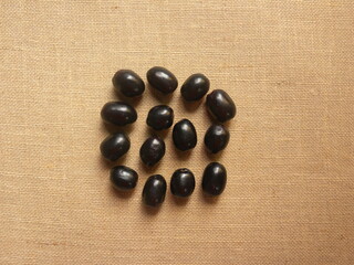 Black color raw whole fresh Java plum fruits or Syzygium cumini