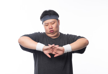 Young Asian funny fat sport man stretching before exercise isolated on white background.