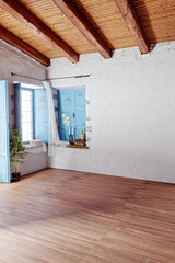 empty room with window and wooden wall
