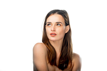 Fototapeta premium Portrait of a beautiful young woman. Long brown hair. Naked shoulders. Looking at side, posing.