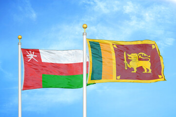Oman and Sri Lanka two flags on flagpoles and blue sky