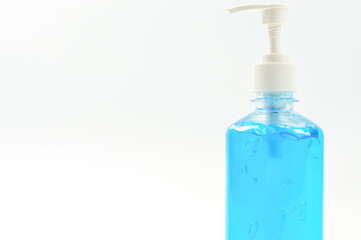 Alcohol gel bottles for hand washing. Disinfecting alcohol. Handwashing alcohol has a clear blue color on a white background.