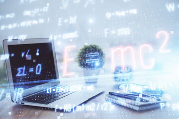 Desktop computer background and formula hologram writing. Double exposure. Education concept.