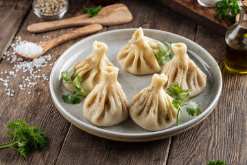 Georgian dumplings khinkali on the wooden table