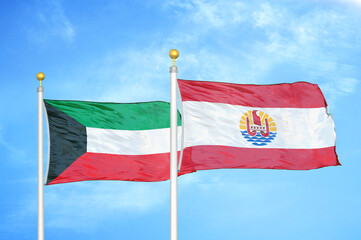 Kuwait and French Polynesia two flags on flagpoles and blue sky