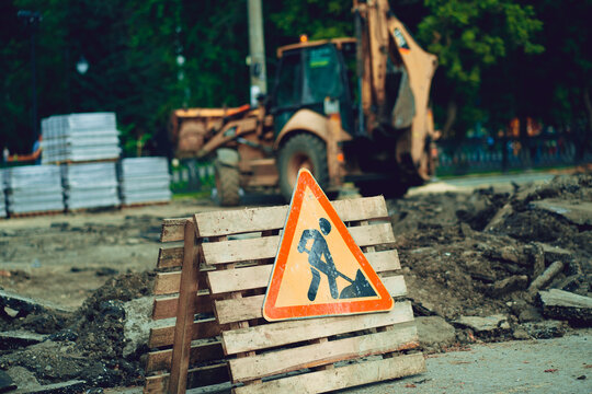 Sign of road work to inform traffic participants about carrying out repairs on road. Concept of careful and attentive driving.