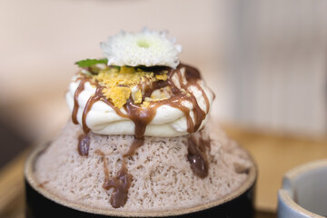Bingsu or Asian Ice flake dessert with sweet milk cream whip