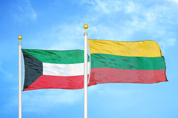 Kuwait and Lithuania two flags on flagpoles and blue sky