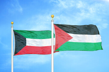 Kuwait and Palestine two flags on flagpoles and blue sky
