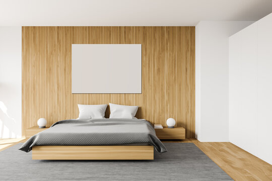 White and wooden bedroom with poster