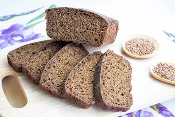 Pieces of homemade whole grain rye bread on a wooden board