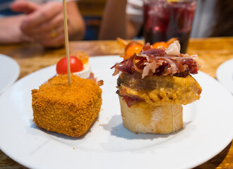 Delicious close up of pintxos/pinchos from San Sebastian (Donostia, Basque Autonomous community, Spain). Typical meal, kind of like spanish tapas.