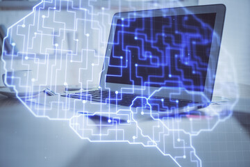 Multi exposure of work table with computer and brain hologram. Brainstorm concept.