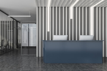 Grey reception desk in wooden office