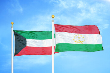 Fototapeta na wymiar Kuwait and Tajikistan two flags on flagpoles and blue sky