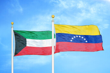 Kuwait and Venezuela two flags on flagpoles and blue sky
