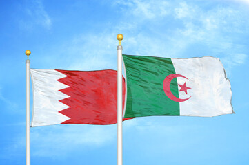 Bahrain and Algeria two flags on flagpoles and blue sky