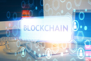 Multi exposure of blockchain theme hologram and table with computer background. Concept of bitcoin...