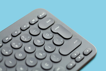 Modern keyboard isolated on blue background.black keyboard.Technology concept on black keyboard