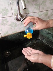 Washing hands with sanitizer gel for prevention of COVID-19