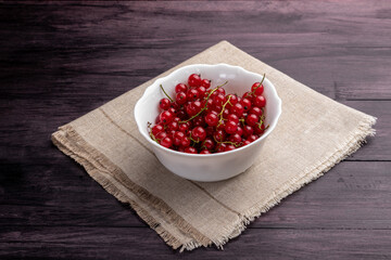 red currants on a wooden table