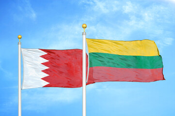 Bahrain and Lithuania two flags on flagpoles and blue sky