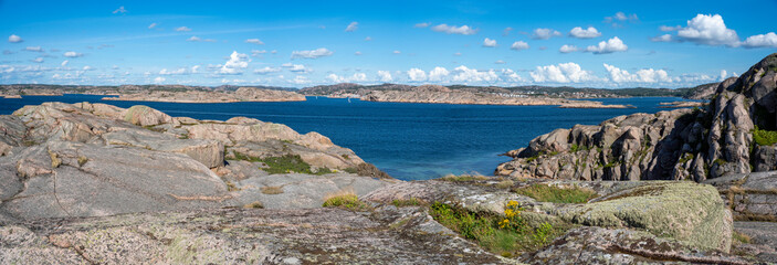 Fototapeta na wymiar Great Panorama view over Bohuslan Rocky Archipelago by the Sea on a summer day with clouds in sky.