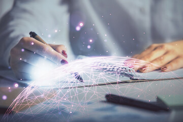 Social network theme hologram over hands taking notes background. Concept of global international people connect. Double exposure
