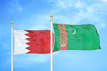 Bahrain and Turkmenistan two flags on flagpoles and blue sky