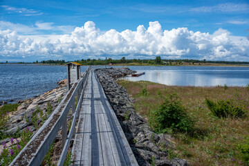 Traditional Fishing Village and Pier with Boat houses by the lake in Sweden on Stor-Rabben Island, Near Pitea in the Archipelago of Gulf of Bothnia in Northern Scandinavia.