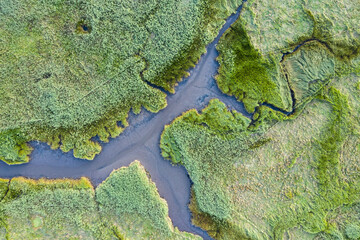 Drone bird's eye view landscape image of tidal wetlands in Christchurch Harbour on England's South Coast