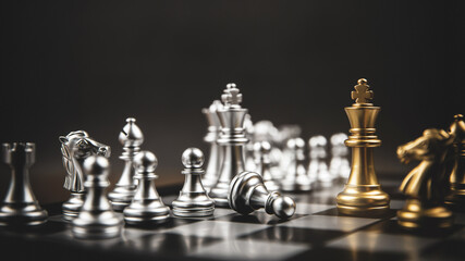King golden chess standing confront of the silver chess team concepts of leadership and business strategy management and leadership.
