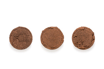 Ground coffee from coffee machine isolated on white background