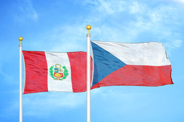 Peru and Czech Republic two flags on flagpoles and blue sky