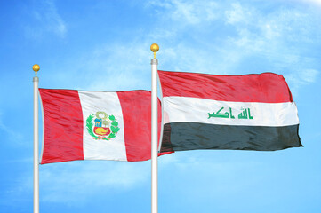 Peru and Iraq two flags on flagpoles and blue sky