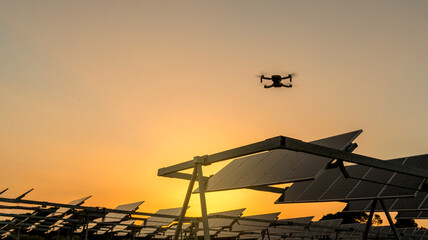 A drone performs maintenance work in a solar park. Concept technology applied to ecology