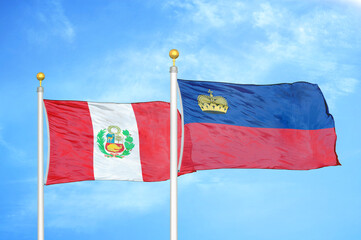 Peru and Liechtenstein two flags on flagpoles and blue sky