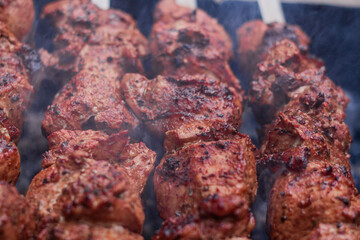 Delicious shish kebab is prepared on the grill