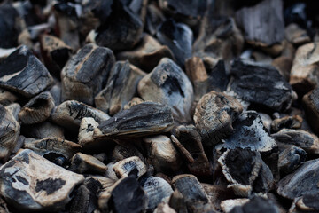 Black hot coal, close-up. Black charcoal background
