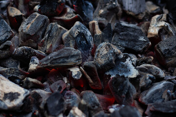 Black hot coal, close-up. Black charcoal background