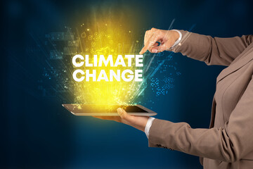 Close-up of a touchscreen with CLIMATE CHANGE inscription, innovative technology concept