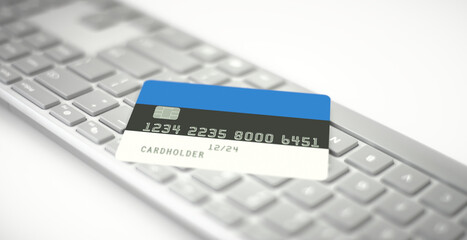 Plastic bank card depicting flag of Estonia on computer keyboard. Fictional numbers
