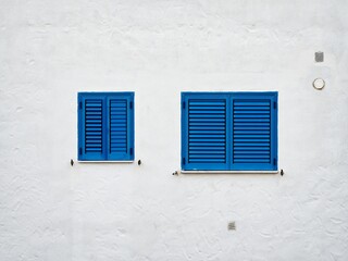 blue windows on white wall