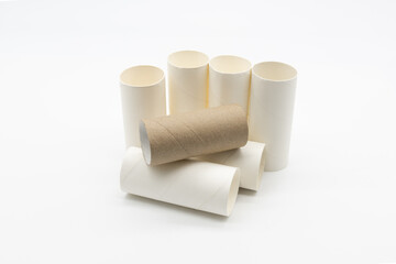 Closeup of a pile of white toilet paper tubes