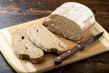 Sliced fresh bread on table close-up.